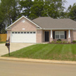 Front of home with grass lawn