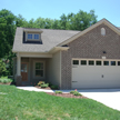 Front of home with grass lawn